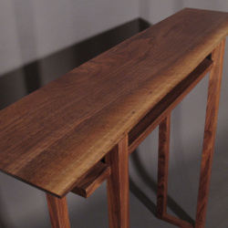 Our Classic Hall Table in solid walnut with a live edge table top. A live edge console table perfectly sized for hallways or entryway furniture